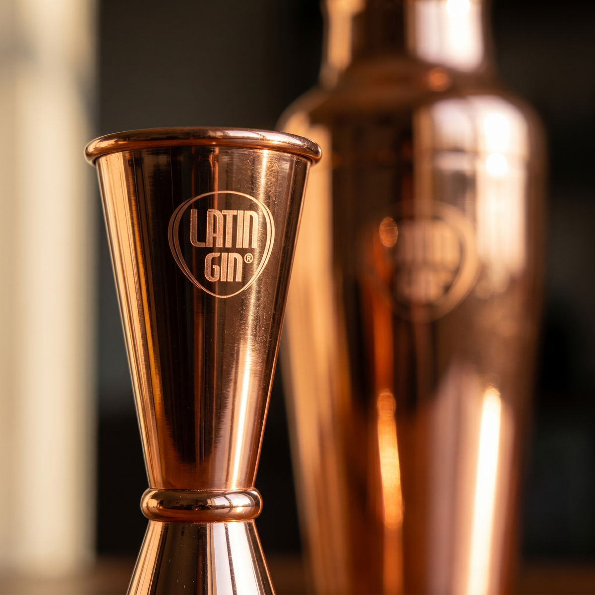 Close-up of the Latin Gin logo on the rose gold jigger