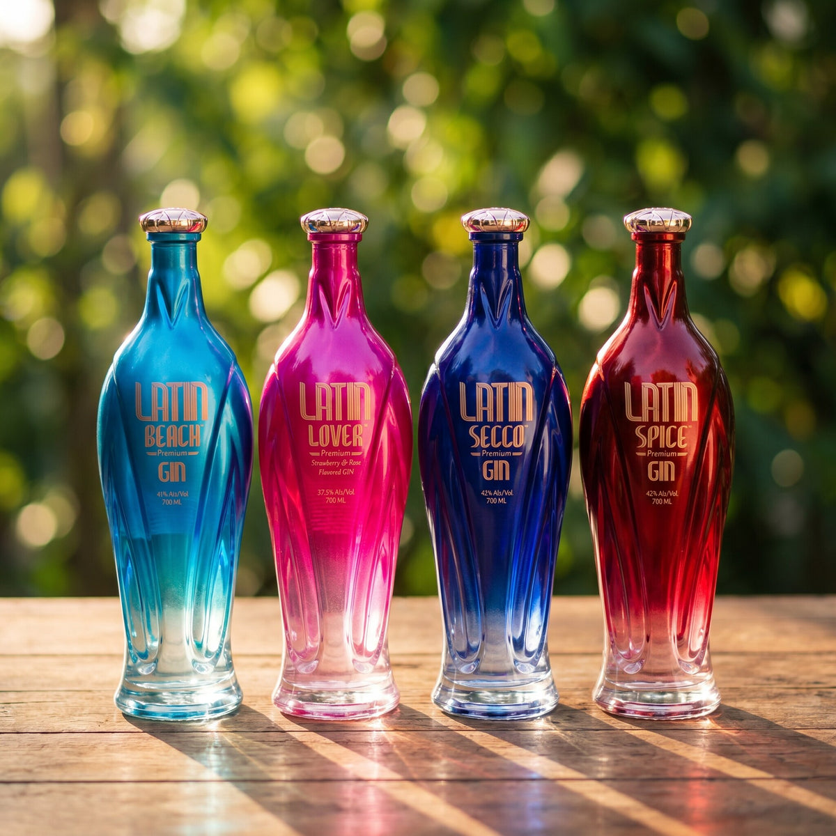 The four Latin Gin bottles together in warm evening light